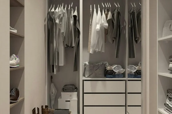 Stylish walk-in closet with neutral tones and contemporary design elements.